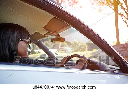 Young woman driving car View Large Photo Image Picture - Young woman driving car. Fotosearch
