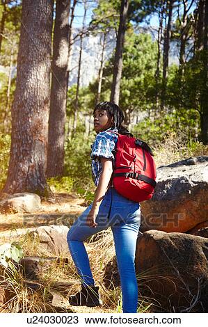 Stock Image - Young woman, hiking, Cape Town, South Africa. Fotosearch