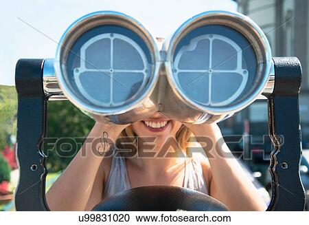 Young woman looking through coin operated binoculars at the Monte dei Cappuccini, Turin, Italy View Large Photo Image Stock Image - Young woman looking through coin operated binoculars at the Monte dei Cappuccini, Turin, Italy. Fotosearch