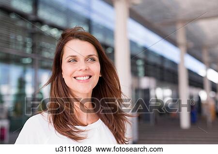 Businesswoman waiting outside airport View Large Photo Image Stock Photo - Businesswoman waiting outside airport. Fotosearch