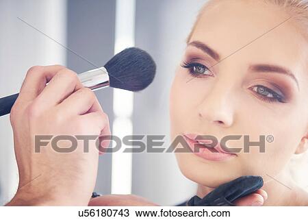 Hand of make up artist applying blusher to model for photo shoot View Large Photo Image Stock Image - Hand of make up artist applying blusher to model for photo shoot. Fotosearch