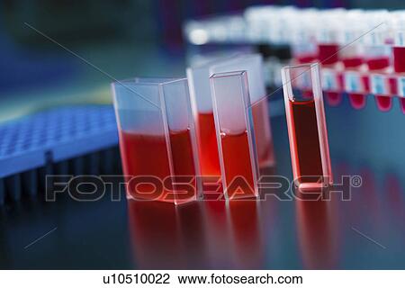 Stock Image - Cuvette containing red liquid.. Fotosearch