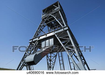 Drilling rig against a clear blue sky. View Large Photo Image Stock Photograph - Drilling rig against a clear blue sky.. Fotosearch