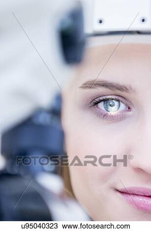 Stock Image - Eye examination of woman. Fotosearch