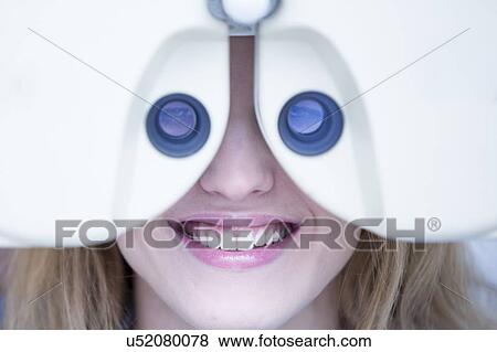 Stock Photo - Eye examination of woman. Fotosearch
