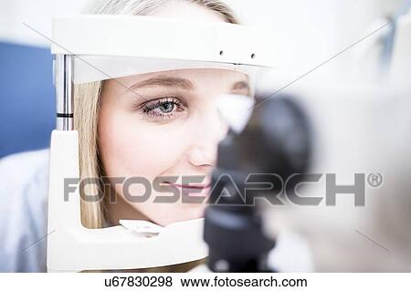 Stock Photo - Eye examination of woman. Fotosearch