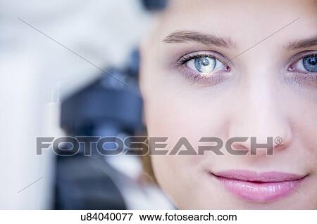 Stock Photo - Eye examination of woman. Fotosearch