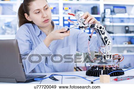 Female engineer working in a robotics laboratory View Large Photo Image Stock Photo - Female engineer working in a robotics laboratory. Fotosearch