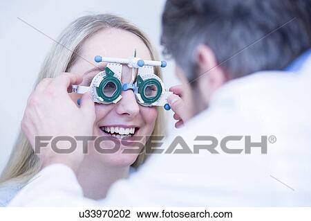 Female patient having eye examination View Large Photo Image Stock Image - Female patient having eye examination. Fotosearch