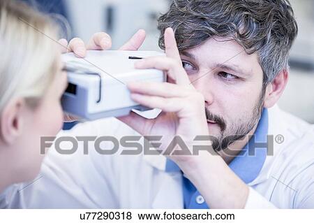 Female patient having eye examination View Large Photo Image Stock Photo - Female patient having eye examination. Fotosearch