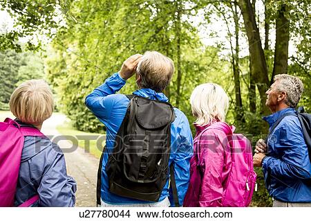 Four people on hike View Large Photo Image Picture - Four people on hike. Fotosearch