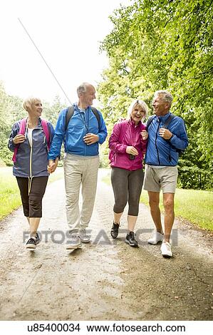 Picture - Four people on hike. Fotosearch