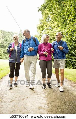 Four people on hike View Large Photo Image Stock Image - Four people on hike. Fotosearch