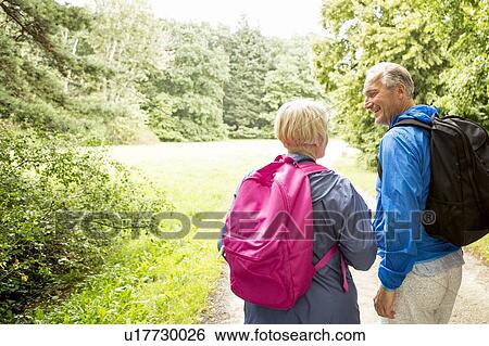 Stock Photograph - Four people on hike. Fotosearch
