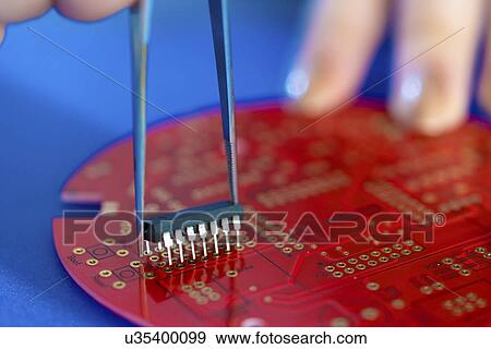 Stock Photo - Integrated circuit on a printed circuit board.. Fotosearch