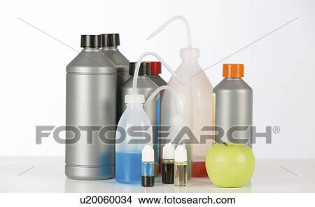 Picture - Laboratory containers and bottles against a white background.. Fotosearch