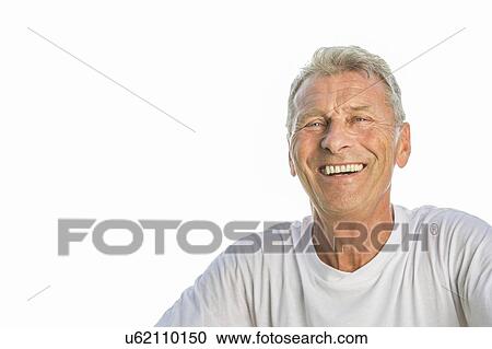 Man smiling against white background, portrait View Large Photo Image Stock Image - Man smiling against white background, portrait. Fotosearch