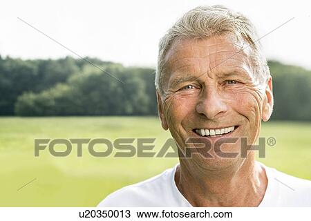 Man smiling towards camera, portrait View Large Photo Image Stock Image - Man smiling towards camera, portrait. Fotosearch