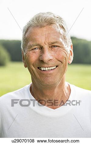 Man smiling towards camera, portrait View Large Photo Image Stock Photo - Man smiling towards camera, portrait. Fotosearch
