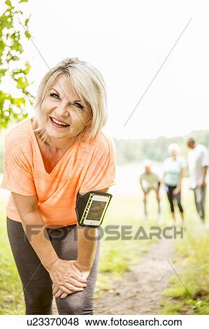 Mature woman resting after exercise View Large Photo Image Stock Photo - Mature woman resting after exercise. Fotosearch