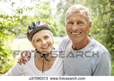 Mature woman wearing bicycle helmet View Large Photo Image Stock Image - Mature woman wearing bicycle helmet. Fotosearch