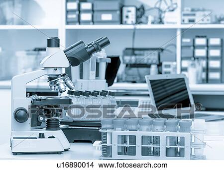 Picture - Microscope and scientific equipment in the laboratory.. Fotosearch