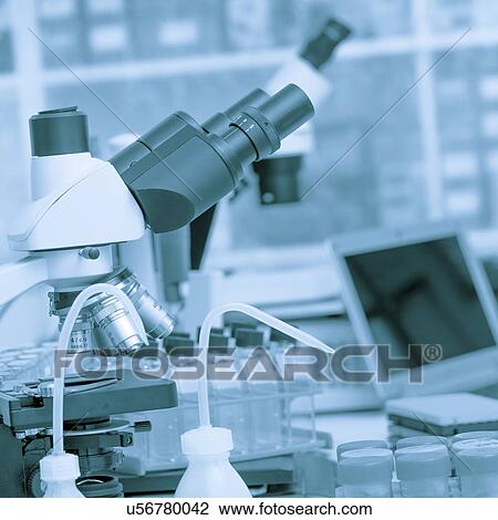 Stock Image - Microscope and scientific equipment in the laboratory.. Fotosearch