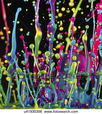 Stock Photograph - Multicoloured splashes against a black background,. Fotosearch
