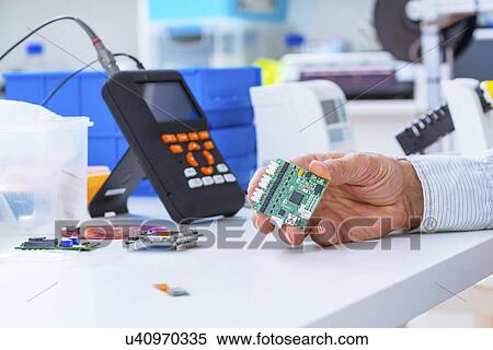 Person holding an electronic circuit board. View Large Photo Image Stock Photography - Person holding an electronic circuit board.. Fotosearch