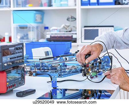 Person working in electronics laboratory. View Large Photo Image Stock Photo - Person working in electronics laboratory.. Fotosearch