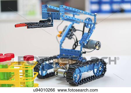 Stock Photograph - Robotic arm and test tubes.. Fotosearch