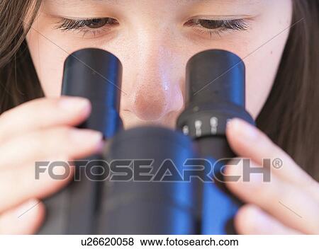 Stock Photo - Science student using microscope. Fotosearch