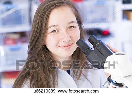Science student using microscope View Large Photo Image Stock Photo - Science student using microscope. Fotosearch
