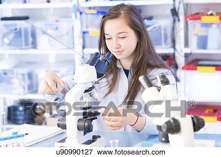 Science student using microscope View Large Photo Image Stock Photo - Science student using microscope. Fotosearch