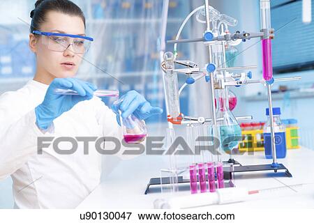 Scientist doing experiment View Large Photo Image Stock Photo - Scientist doing experiment. Fotosearch