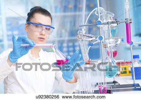 Scientist doing experiment View Large Photo Image Stock Photograph - Scientist doing experiment. Fotosearch