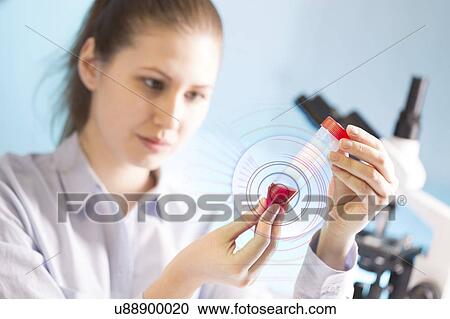 Scientist holding test tube View Large Photo Image Stock Image - Scientist holding test tube. Fotosearch