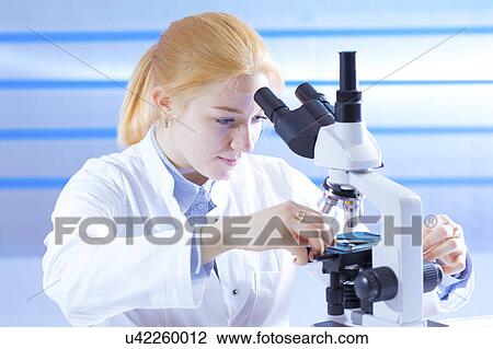 Scientist using microscope View Large Photo Image Stock Image - Scientist using microscope. Fotosearch