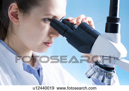 Scientist using microscope View Large Photo Image Stock Photo - Scientist using microscope. Fotosearch