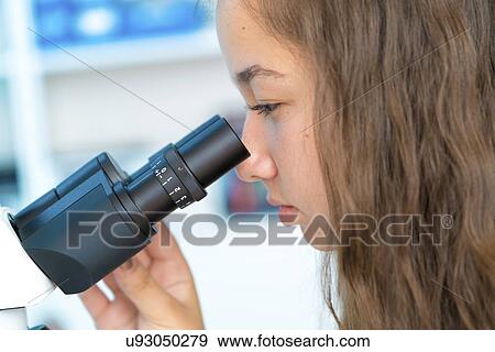 Scientist using microscope View Large Photo Image Stock Photo - Scientist using microscope. Fotosearch