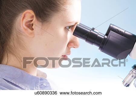 Scientist using microscope View Large Photo Image Stock Photograph - Scientist using microscope. Fotosearch