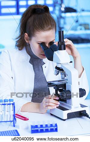 Scientist using microscope View Large Photo Image Stock Photography - Scientist using microscope. Fotosearch
