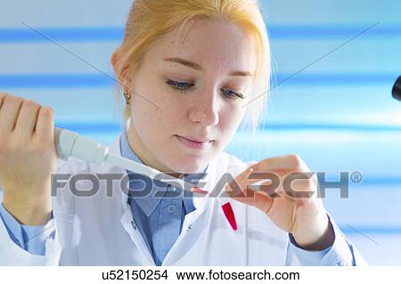 Scientist using pipette View Large Photo Image Picture - Scientist using pipette. Fotosearch