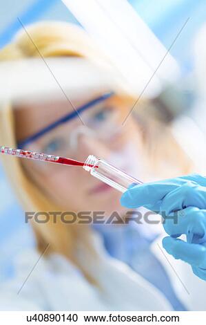 Scientist using pipette View Large Photo Image Stock Image - Scientist using pipette. Fotosearch