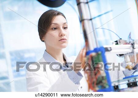 Stock Image - Scientist working in laboratory. Fotosearch