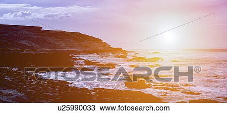 Stock Image - Seascape at sunset.. Fotosearch