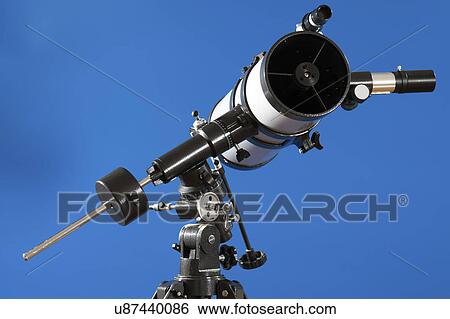 Stock Photograph - Telescope against blue background.. Fotosearch