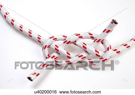 Stock Photograph - The Carrick Bend or The Josephine Knot AKA Sailor's Knot and Anchor Bend on white background Used to tie to lengths of rope together. Fotosearch