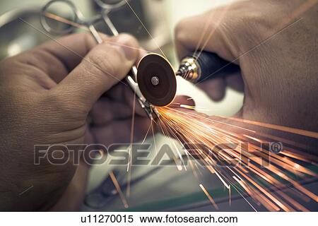 Stock Photography - Tool used in the production of dental prosthesis, close up.. Fotosearch