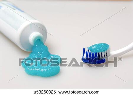 Stock Photography - Toothpaste and tooth brush on white background. Fotosearch